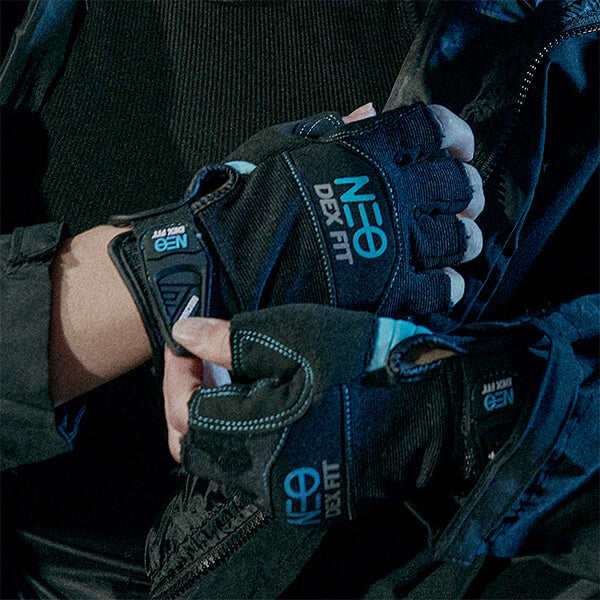 Wearing the Mechanic Fingerless Gloves MG310 in Black showing a closer look of the easy pull tab which makes the glove easy to pull on and off.