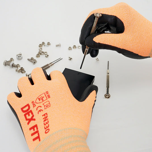 The Nitrile-Coated Work Gloves FN330 in Orange being worn while performing a task that requires precision.