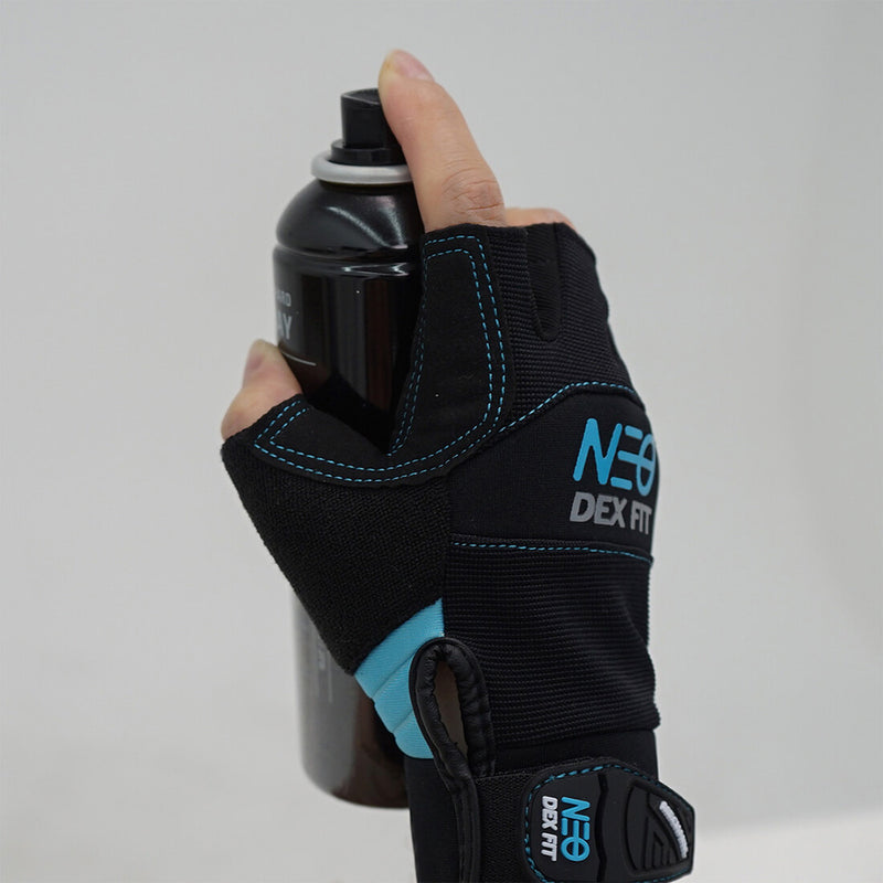 Load image into Gallery viewer, Holding a spray bottle while wearing the Mechanic Fingerless Gloves MG310 in Black showing a closer look of the easy pull tab which makes the glove easy to pull on and off.

