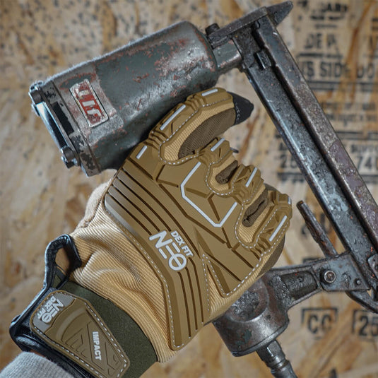 Mechanic Impact Resistant Gloves MG310 in Sand using a nail gun, boasting its high-quality, flexible materials, and 3D-comfort fit providing the ultimate comfort while working.