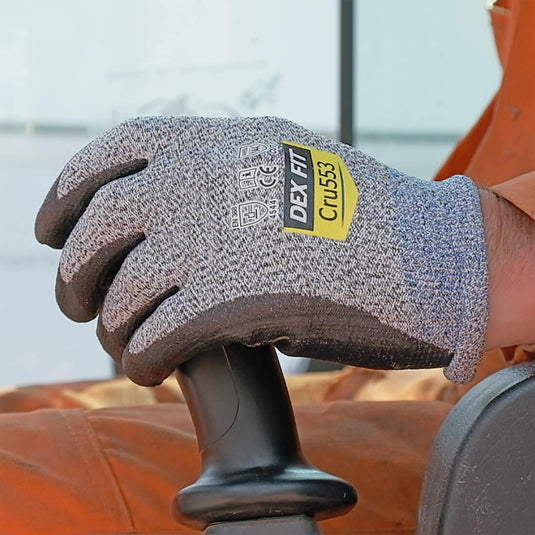 Level 5 Cut Resistant Gloves Cru553 in Gray being used for heavy duty tasks like transporting, highlighting its excellent grip and superior protection.
