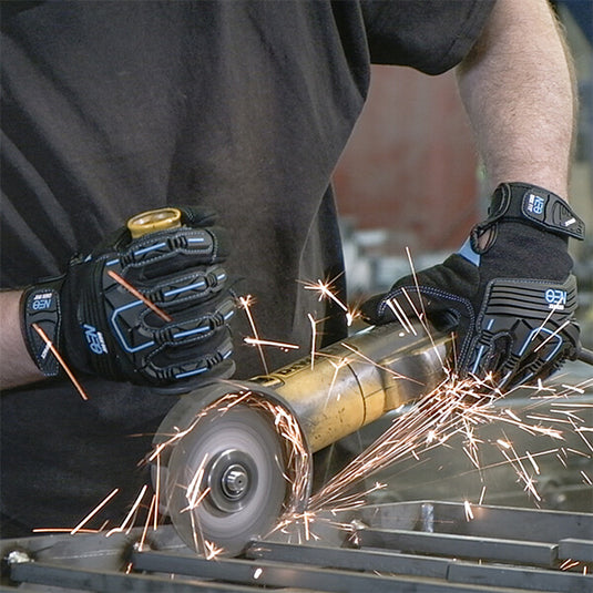 Mechanic Impact Resistant Gloves MG310 in Black using a metal grinder, boasting its high-quality, flexible materials, and 3D-comfort fit providing the ultimate comfort while working.