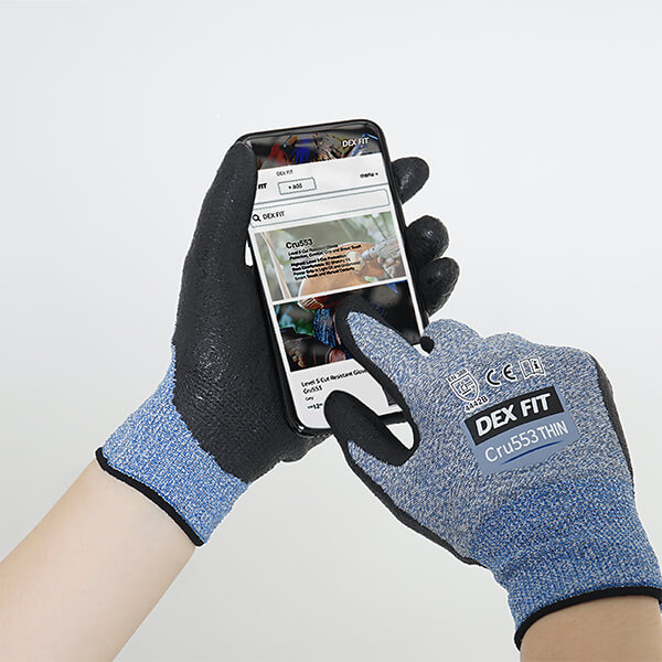 Wearing the Level 4 Cut Resistant Gloves Cru553 Thin in Blue while using a touchscreen smartphone