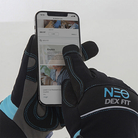 Wearing the Mechanic Winter Gloves MG310 while using a touchscreen device to show its three touchscreen-compatible fingers.